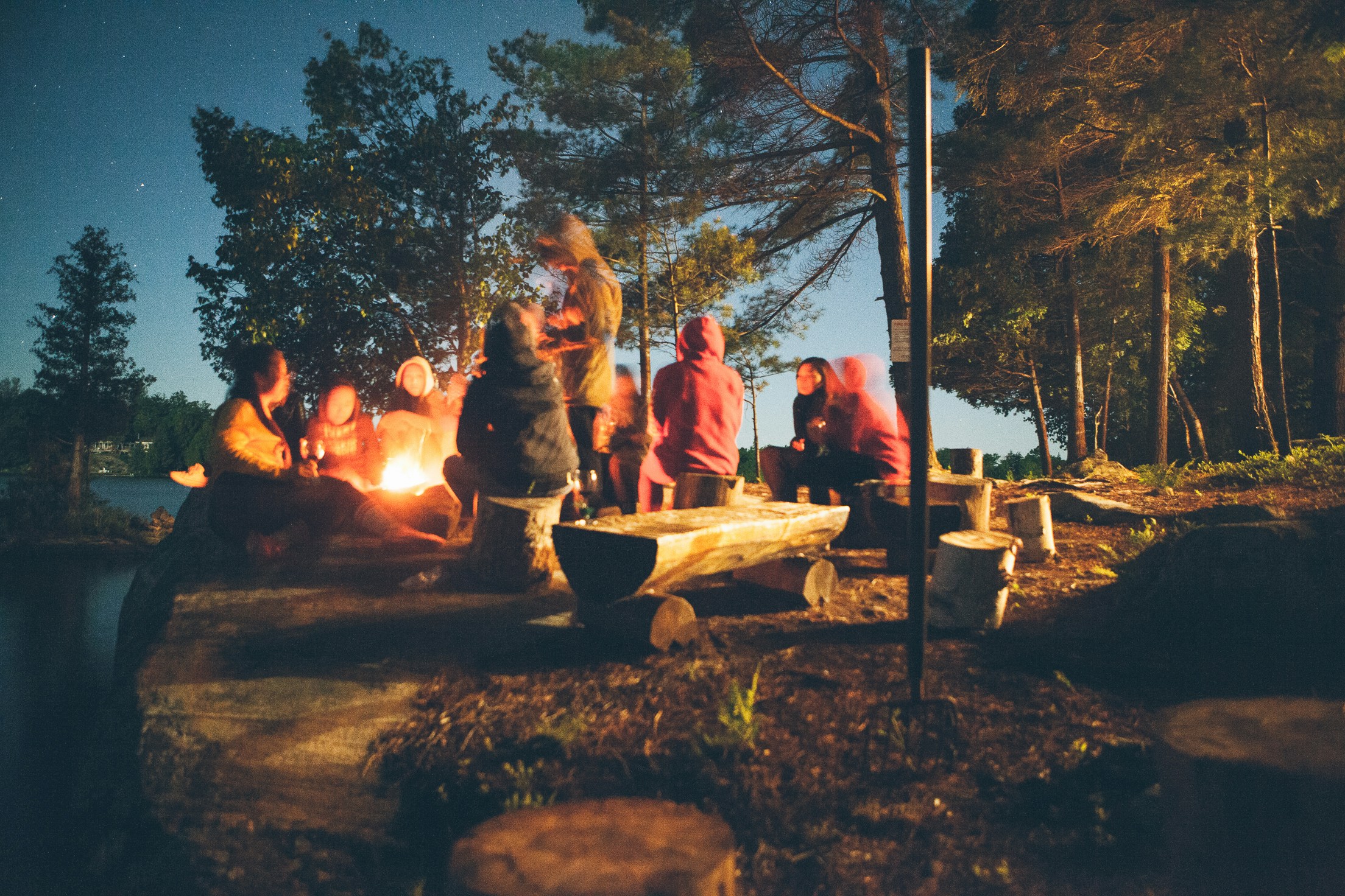 Image of friends around a campfire
