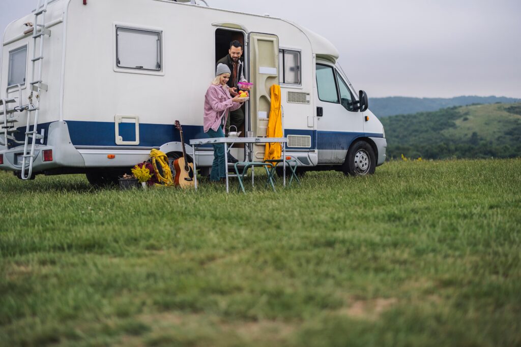 rv with happy campers cooking 